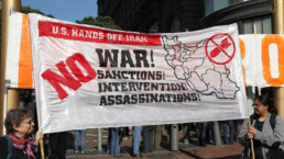 Demonstrators protesting at a No War With Iran action on Market Street in San Francisco.