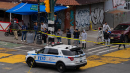Members of the NYPD Crime Scene Unit instigate the scene where officers from the 34th precinct fatally shot an armed man who refused to drop his gun.
