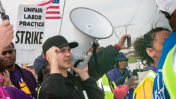 Striking workers and supporters from the Walmart distribution center march for better wages and working conditions.
