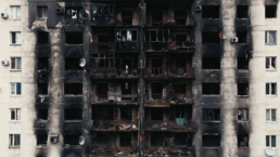 blackened building facade after bombing in ukraine