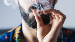Portrait of anonymous man smoking weed