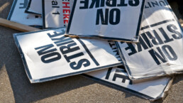 strike signs lying on the ground