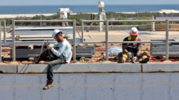 men working outside in a hot environment