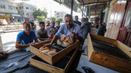 Palestinians wait in front of bakeries to get bread, Rafah camp, south of the Gaza Strip, on October 15 2023