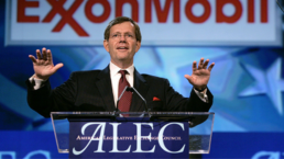 a speaker at ALEC stands at the podium