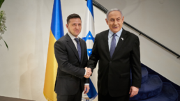 Zelensky and Netanyahu shake hands in front of their respective flags