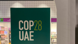 a cop28 sign heralds the coming event