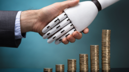 man and robot shaking hands with coins stacked up representing increased profits