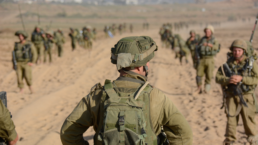 IDF soldiers standing in Gaza