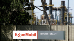 exxon refinery in torrance, with a sign outside the facility