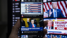 trump wins in iowa headlines on phone