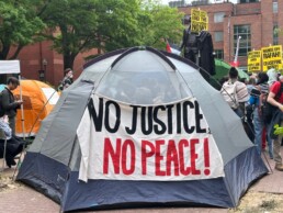 No Justice No PEace! sign on tent at pro peace rally on university campus