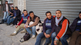 journalists in gaza take a break on the street
