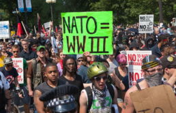 nato equals wwiii sign at anti nato protest in 2012