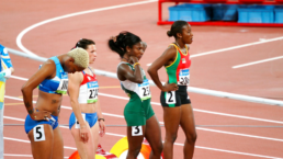 runners line up on a track at the olympics