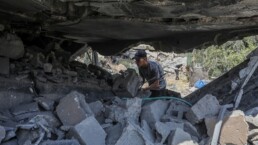 Palestinians inspect the site of an Israeli airstrike in Deir al-Balah, in the central Gaza Strip, on August 10, 2024