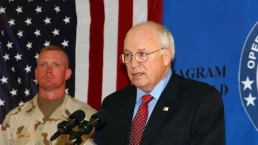 dick cheney talking at a podium