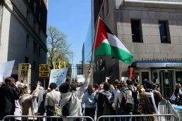 April 22, 2024 : Pro-Palestinian protesters holding flags and signs on Broadway outside of Columbia University showing support for the student protest encampment on campus