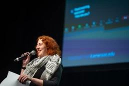 Anna Feder introducing the 23rd Emerson College Film Festival in the Paramount Theatre on March 20, 2024. (Photo: Christopher McIntosh)