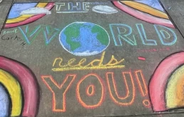 Students at Trafford Middle School took advantage of a beautiful day in early November to write positive messages on the sidewalk outside of the school. CC image via Penn-Trafford School District