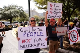 Activists protest Donald Trump's policies, including the creation of DOGE under Elon Musk, at the state capital.