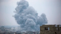 a cloud goes up after an explosion in syria