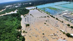 a town is flooded by water, aerial view