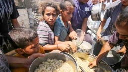 hungry children scrounge for food in gaza