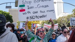 Protesters attend a demonstration calling for “No War on Iran,” “No War on Immigrants,” and “No War on Palestine” at Pershing Square in downtown Los Angeles on June 21, 2025.