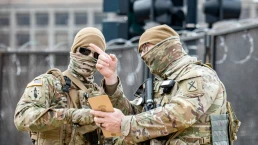 national guard troops cover their faces