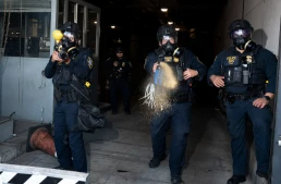 Los Angeles, California, USA, 662025: Protest against ICE at Main Detention Center on Alameda street. DHS agents mace and tear gas protestors.