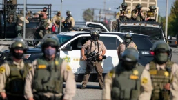Police guard as a protest outside a Sheriff's Station to demand prosecution of the deputies who were involved in the shooting deaths of Anthony Weber and Dijon Kizzee, Sept. 27, 2020 in Los Angeles.