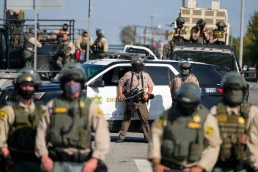 Police guard as a protest outside a Sheriff's Station to demand prosecution of the deputies who were involved in the shooting deaths of Anthony Weber and Dijon Kizzee, Sept. 27, 2020 in Los Angeles.