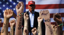 resisting trump, fists in air in front of trump and usa flag