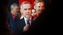 The image shows Mark Carney, the former Governor of the Bank of England and the Bank of Canada, who was recently sworn in as the Prime Minister of Canada. in New York City, October 7, 2025