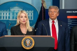 pam bondi at podium near donald trump