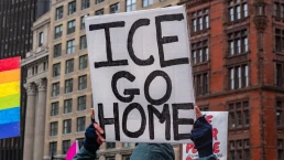 ICE GO HOME sign at protest
