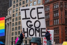ICE GO HOME sign at protest