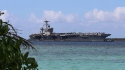 The USS Abraham Lincoln pulls into Guam for a scheduled port visit on December 11, 2025 (US Navy photo)