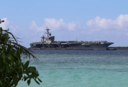 The USS Abraham Lincoln pulls into Guam for a scheduled port visit on December 11, 2025 (US Navy photo)