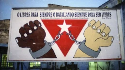 Billboard quoting Cuban independence leader José Martí “Either Free Forever, or Forever Fighting to Be Free.”