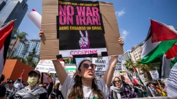 Protesters attend a demonstration calling for “No War on Iran,” “No War on Immigrants,” and “No War on Palestine” at Pershing Square in downtown Los Angeles on June 21, 2025.