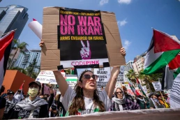 Protesters attend a demonstration calling for “No War on Iran,” “No War on Immigrants,” and “No War on Palestine” at Pershing Square in downtown Los Angeles on June 21, 2025.