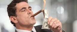 rich guy burning money with cigar