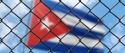 Cuban flag behind fence