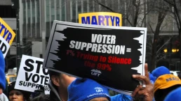 voter suppression rally sign