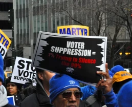 voter suppression rally sign