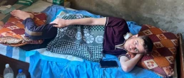 Mohammed Khaled Afana lying in bed, unable to move. - Truthout