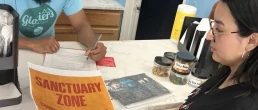 Canvassers talk to independent business owners in Atlanta to invite them to become Sanctuary Zones that prevent ICE and police from entering their establishments. (GLAHR)
