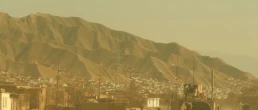 PULI KHUMRI, AFGHANISTAN, MAR 21, 2011: American military convoy travels through the town of Puli Khumri Afghanistan in Baghlan Province.